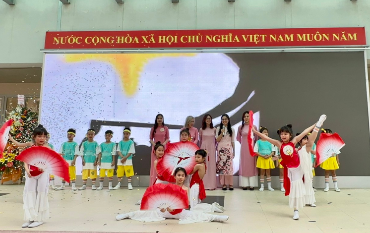 A group of people performing on stage

Description automatically generated with medium confidence
