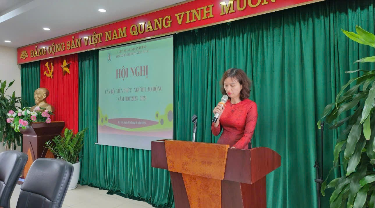 A person standing at a podium with microphones

AI-generated content may be incorrect.