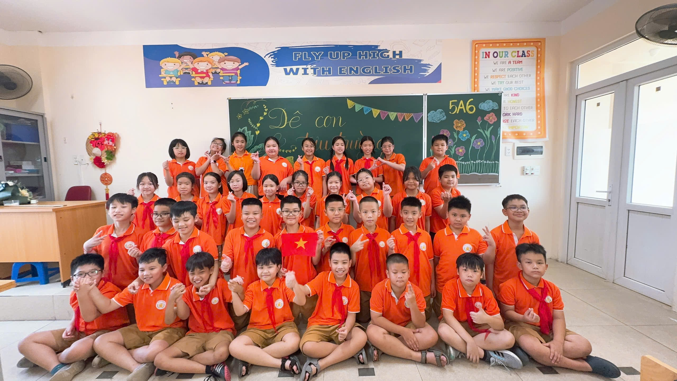 A group of children in orange uniforms
AI-generated content may be incorrect.