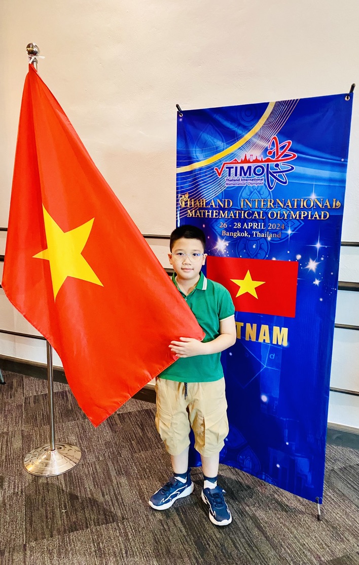 A child holding a flag

Description automatically generated