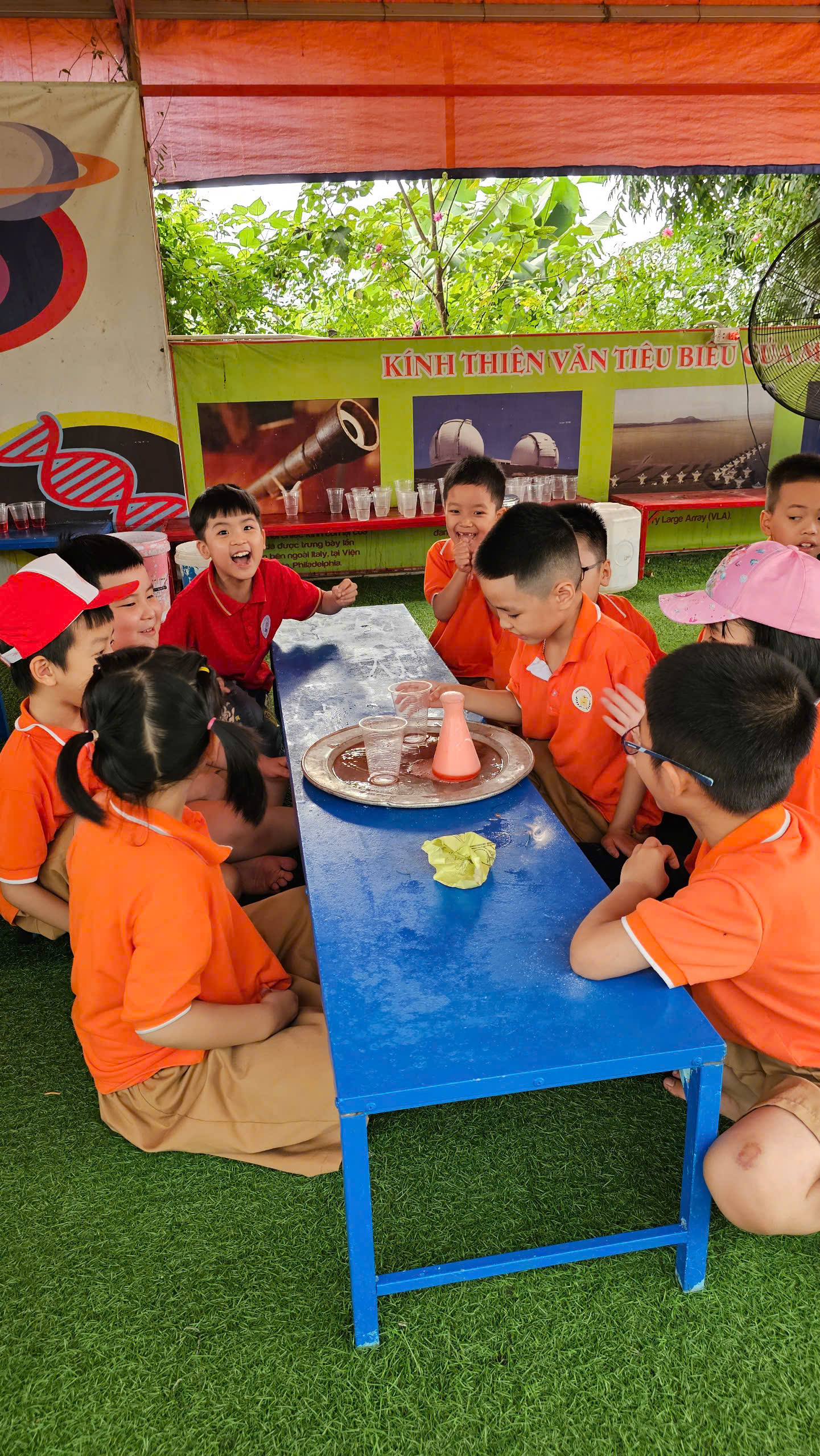 A group of children sitting around a table

AI-generated content may be incorrect.