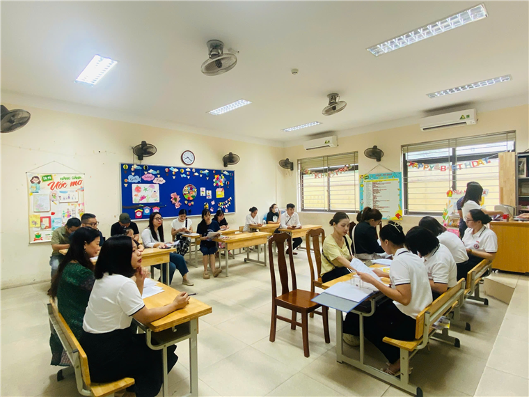 A group of people sitting at desks in a classroom

AI-generated content may be incorrect.