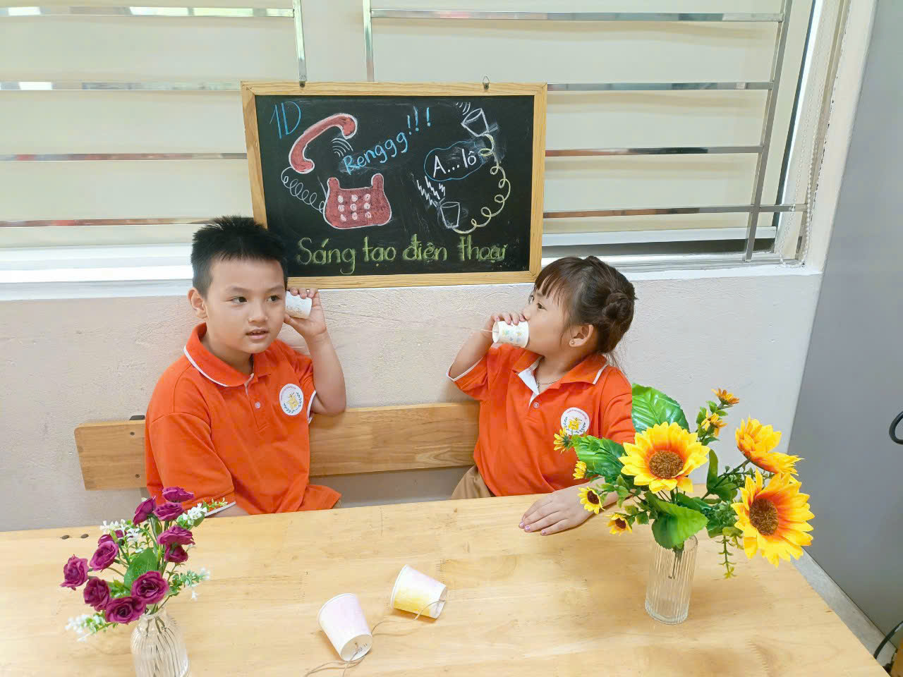 A child and child sitting at a table

AI-generated content may be incorrect.