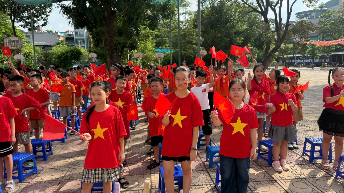 A group of people in red shirts with flags

AI-generated content may be incorrect.