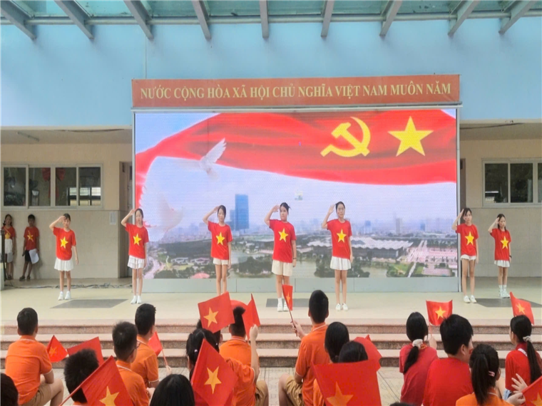 A group of people in red shirts holding flags

AI-generated content may be incorrect.