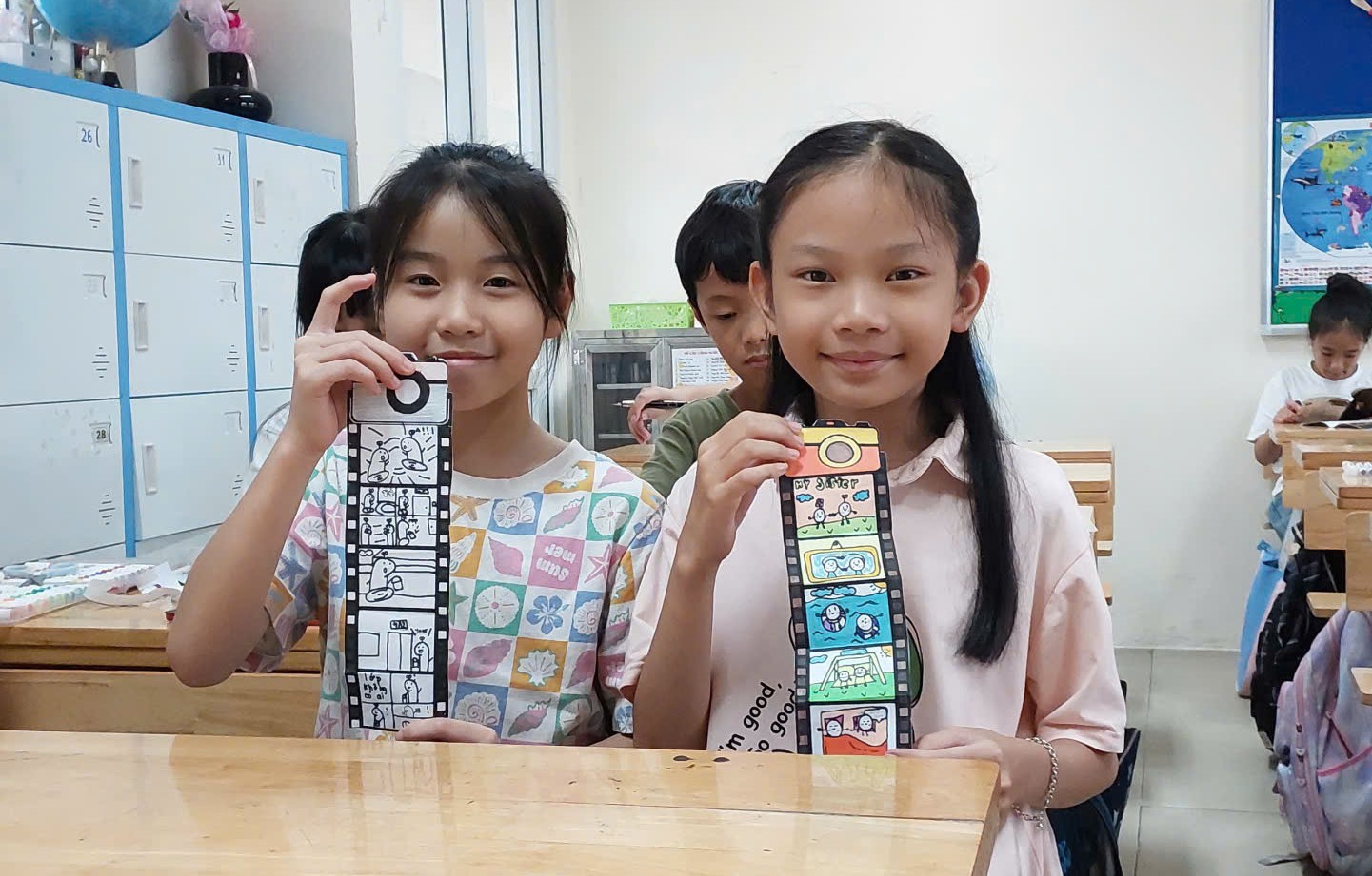 A group of children holding up paper

AI-generated content may be incorrect.
