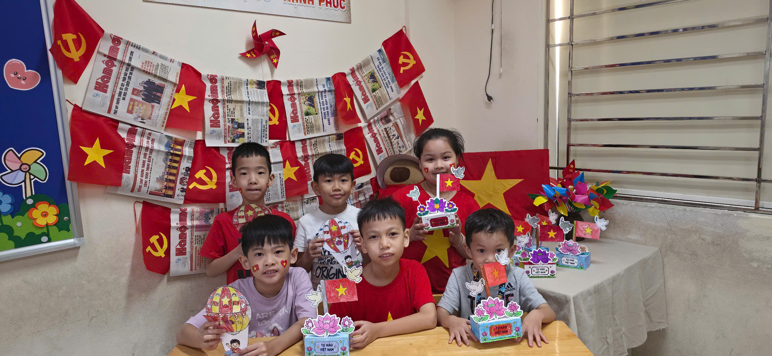A group of children sitting at a table with decorations

AI-generated content may be incorrect.
